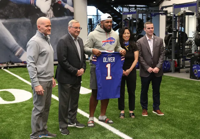 Bills top draft pick Ed Oliver, with head coach Sean McDermott, owner Terry and Kim Pegula along with general manager Brandon Beane.
