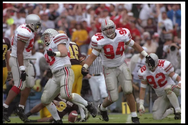 Ohio State Buckeyes' Mike Vrabel (right) and linebacker Gerg Bellisari celebrate during the Rose Bowl against the Arizona State Sun Devils.
