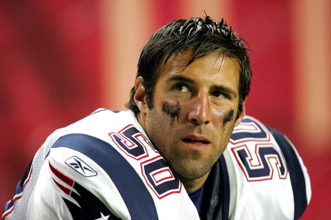 Mike Vrabel of the New England Patriots watches the scoreboard during their preseason game against the Atlanta Falcons.