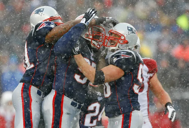 New England Patriots linebacker Mike Vrabel (50), defensive lineman Jarvis Green (97) and linebacker Jerod Mayo (51) react after a defensive stop.