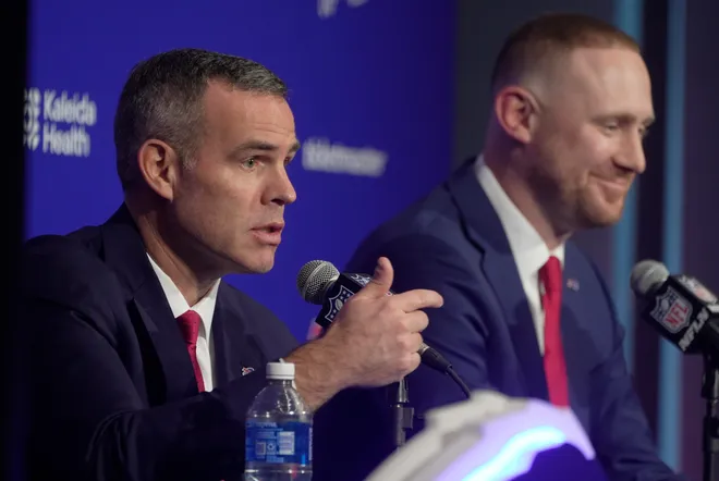 Brandon Beane, president of football operations and general manager for the Buffalo BIlls, and head coach Joe Brady take turns answering questions during a press conference that introduced Brady as the new head coach at the Bills field house in Orchard Park on Jan. 29, 2026.