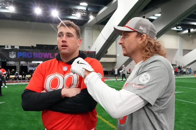 Feb 2, 2026; San Francisco, CA, USA; Pittsburgh Steelers special teams player Ben Skowronek interviews Denver Broncos defensive lineman Zach Allen (99) during AFC practice at the NFL Flag Fieldhouse at Moscone Center South Building. Mandatory Credit: Kirby Lee-Imagn Images