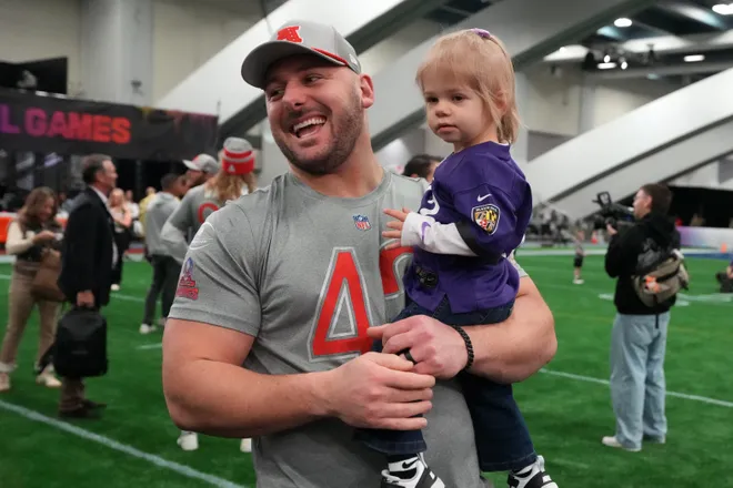 Feb 2, 2026; San Francisco, CA, USA; Baltimore Ravens fullback Patrick Ricard (42) holds daughter Emerson Ricard during AFC practice at the NFL Flag Fieldhouse at Moscone Center South Building. Mandatory Credit: Kirby Lee-Imagn Images