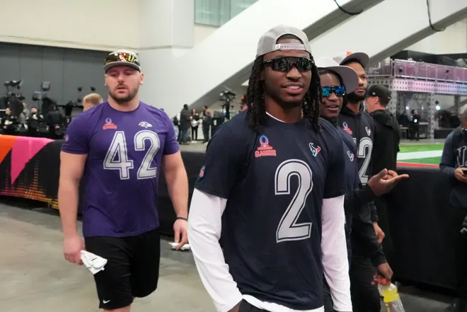 Feb 1, 2026; San Francisco, CA, USA; Houston Texans afety 
Calen Bullock (2) and Baltimore Ravens fullback Patrick Ricard (42) during AFC practice at the Flag Fieldhouse Moscone Center South Building. Mandatory Credit: Kirby Lee-Imagn Images