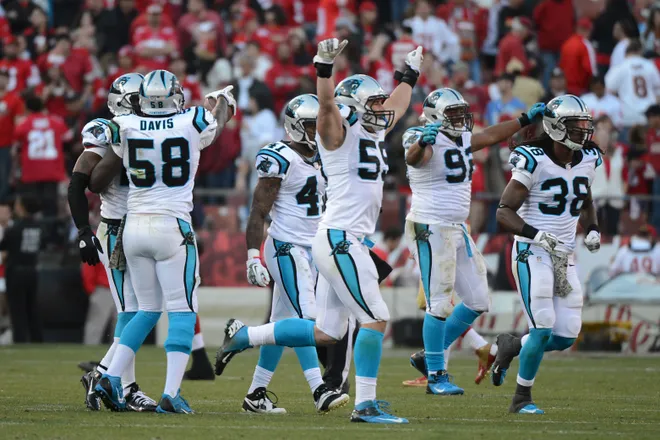 November 10, 2013; San Francisco, CA, USA; Carolina Panthers middle linebacker Luke Kuechly (59) celebrates with his teammates after an interception by cornerback Drayton Florence (29, not pictured) during the fourth quarter against the San Francisco 49ers at Candlestick Park. The Panthers defeated the 49ers 10-9. Mandatory Credit: Kyle Terada-USA TODAY Sports