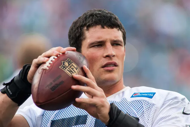 Jul 25, 2014; Charlotte, NC, USA; Carolina Panthers middle linebacker Luke Kuechly (59) throws a football on the sidelines during training camp at Bank of America Stadium. Mandatory Credit: Jeremy Brevard-USA TODAY Sports