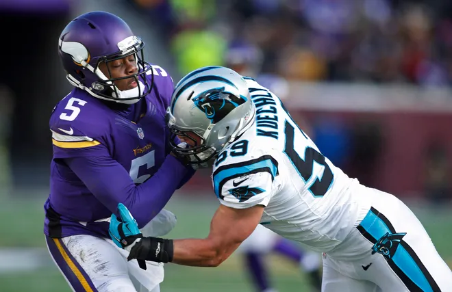 Nov 30, 2014; Minneapolis, MN, USA; Carolina Panthers linebacker Luke Kuechly (59) pressures Minnesota Vikings quarterback Teddy Bridgewater (5) in the third quarter at TCF Bank Stadium. The Vikings win 31-13. Mandatory Credit: Bruce Kluckhohn-USA TODAY Sports