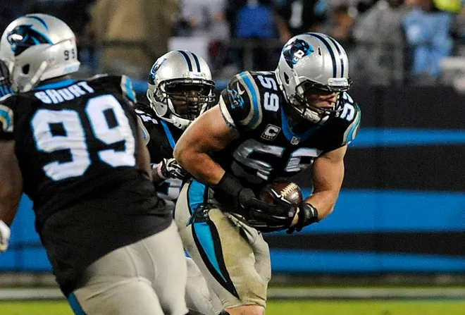 Nov 2, 2015; Charlotte, NC, USA; Carolina Panthers linebacker Luke Kuechly (59) makes an interception in overtime during the second half of the game against the Indianapolis Colts at Bank of America Stadium. Carolina wins in overtime 29-26. Mandatory Credit: Sam Sharpe-USA TODAY Sports