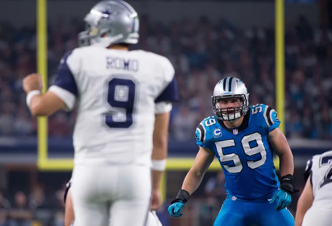 Nov 26, 2015; Arlington, TX, USA; Carolina Panthers middle linebacker Luke Kuechly (59) stares down Dallas Cowboys quarterback Tony Romo (9) during the game on Thanksgiving at AT&T Stadium. The Panthers defeat the Cowboys 33-14. Mandatory Credit: Jerome Miron-USA TODAY Sports