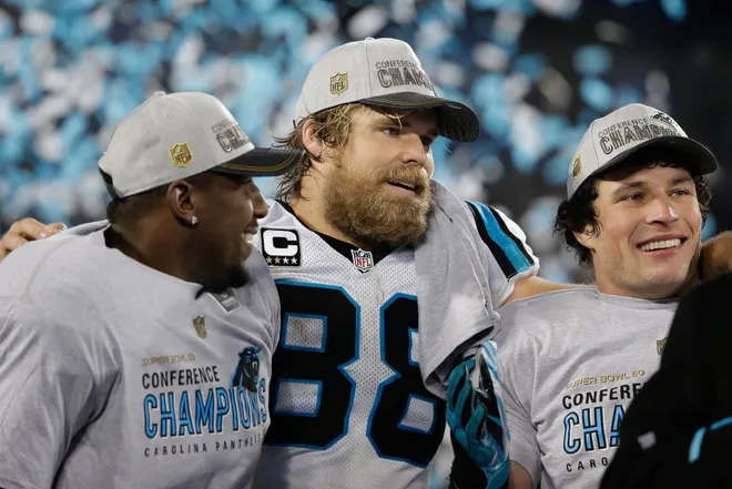 Jan 24, 2016; Charlotte, NC, USA; Carolina Panthers tight end Greg Olsen (88) celebrates with outside linebacker Thomas Davis (58) and middle linebacker Luke Kuechly (59) during the trophy presentation after defeating the Arizona Cardinals during the NFC Championship football game held at Bank of America Stadium. Mandatory Credit: Jeremy Brevard-USA TODAY Sports