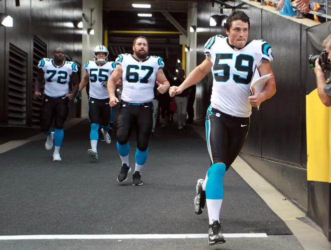 Aug 30, 2018; Pittsburgh, PA, USA; Carolina Panthers linebacker Luke Kuechly (59) and teammates run from the tunnel to play the Pittsburgh Steelers during the first quarter at Heinz Field. Pittsburgh won 39-24. Mandatory Credit: Charles LeClaire-USA TODAY Sports