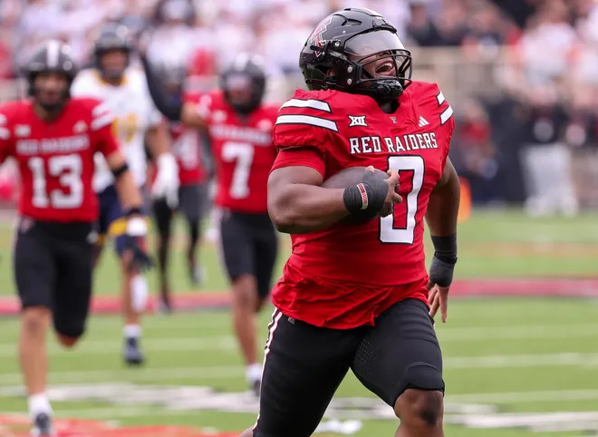 Texas Tech defensive lineman Skyler Gill-Howard returns an interception for a touchdown against Kent State, Saturday, September 6, 2025, at Jones AT&T Stadium.