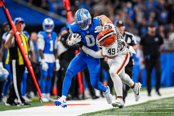 Detroit Lions running back Jahmyr Gibbs (0) runs for a first down against Cleveland Browns linebacker Carson Schwesinger (49) during the second half at Ford Field in Detroit on Sunday, Sept. 28, 2025.