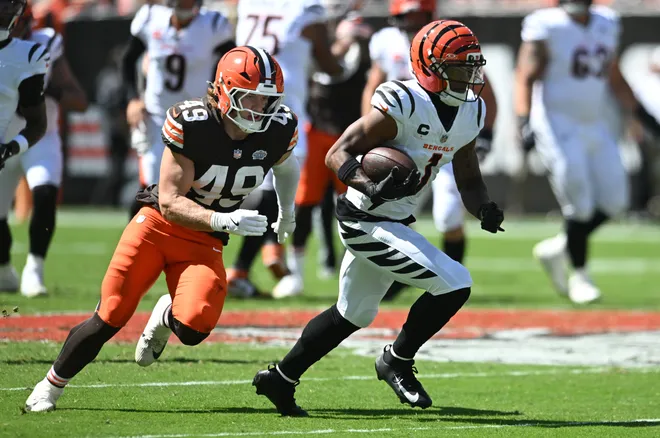 Sep 7, 2025; Cleveland, Ohio, USA; Cincinnati Bengals wide receiver Ja'Marr Chase (1) runs against Cleveland Browns linebacker Carson Schwesinger (49) during the first half at Huntington Bank Field. Mandatory Credit: Ken Blaze-Imagn Images