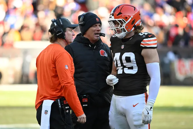 Dec 21, 2025; Cleveland, Ohio, USA; Cleveland Browns linebacker Carson Schwesinger (49) talks with defensive coordinator Jim Schwartz on the during the second half against the Buffalo Bills at Huntington Bank Field. Mandatory Credit: Ken Blaze-Imagn Images