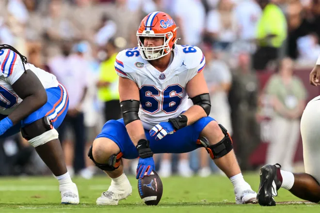 Oct 11, 2025; College Station, Texas, USA; Florida Gators offensive lineman Jake Slaughter (66) sets the ball during the first half against the Texas A&M Aggies at Kyle Field. Mandatory Credit: Maria Lysaker-Imagn Images