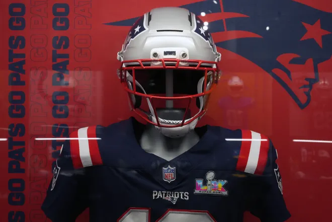 The helmet and jersey of New England Patriots quarterback Drake Maye.