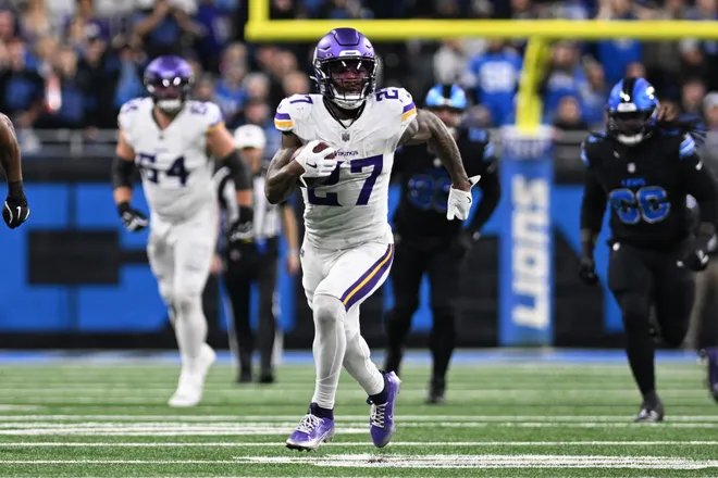 Jan 5, 2025; Detroit, Michigan, USA; Minnesota Vikings running back Cam Akers (27) breaks off a long run against the Detroit Lions in the third quarter at Ford Field. Mandatory Credit: Lon Horwedel-Imagn Images