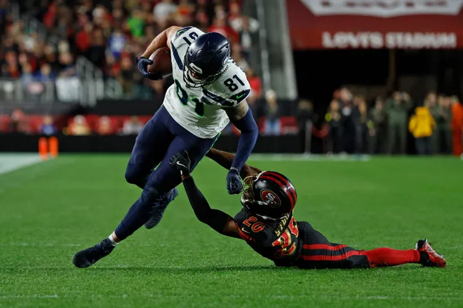 Jan 3, 2026; Santa Clara, California, USA; Seattle Seahawks tight end Eric Saubert (81) makes a catch against San Francisco 49ers cornerback Upton Stout (20) during the second half at Levi's Stadium. Mandatory Credit: Sergio Estrada-Imagn Images