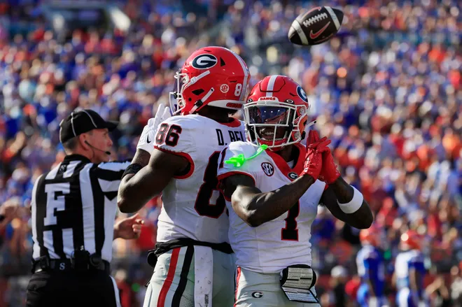 Georgia Bulldogs wide receiver Dillon Bell (86) reacts to scoring a touchdown with teammate wide receiver Zachariah Branch (1) during the first quarter of an NCAA football game, Saturday, Nov. 1, 2025, at EverBank Stadium in Jacksonville, Fla. Georgia held off Florida 24-20.