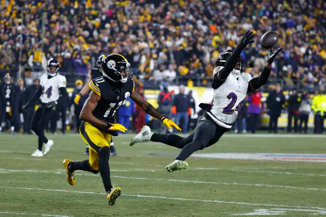 Malaki Starks #24 of the Baltimore Ravens breaks up a pass intended for Marquez Valdes-Scantling #11 of the Pittsburgh Steelers