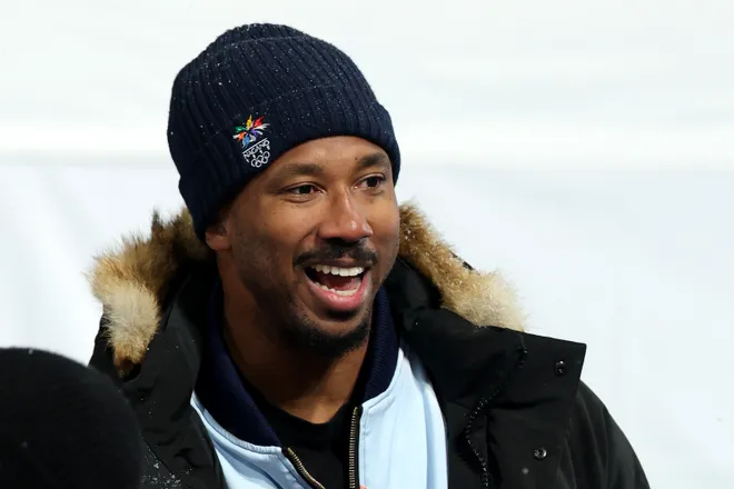 Cleveland Browns defensive end Myles Garrett attends the Women's Snowboard Halfpipe Final wearing a jacket in support of Chloe Kim.