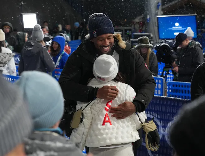 Cleveland Browns player Myles Garrett greets Chloe Kim.