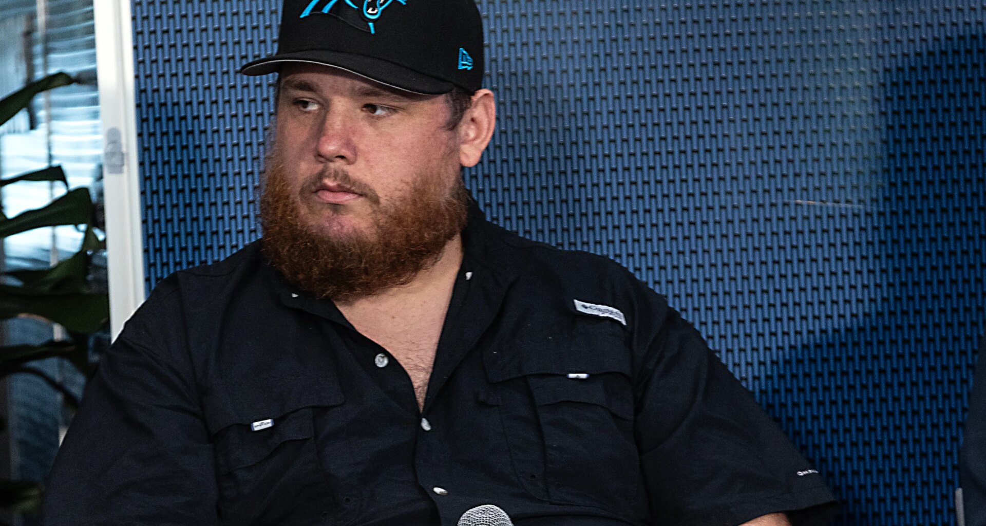 Panthers fans take aim at musician Luke Combs for wearing Jaguars hat