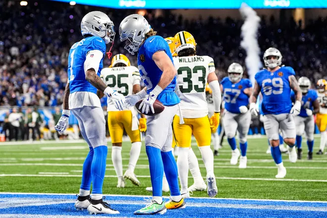 Detroit Lions wide receiver Isaac TeSlaa (18) celebrates a touchdown against Green Bay Packers with wide receiver Jameson Williams (1) during the second half at Ford Field in Detroit on Thursday, Nov. 27, 2025.