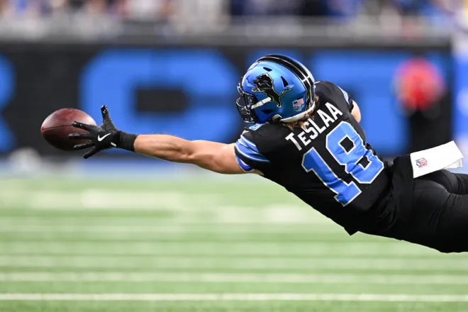 Nov 23, 2025; Detroit, Michigan, USA; Detroit Lions wide receiver Isaac TeSlaa (18) reaches for a pass in the fourth quarter against the New York Giants at Ford Field. Mandatory Credit: Lon Horwedel-Imagn Images
