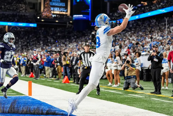 Detroit Lions wide receiver Isaac TeSlaa tries to catch a pass intended for him against the Dallas Cowboys during the second half at Ford Field in Detroit on Thursday, Dec. 4, 2025.