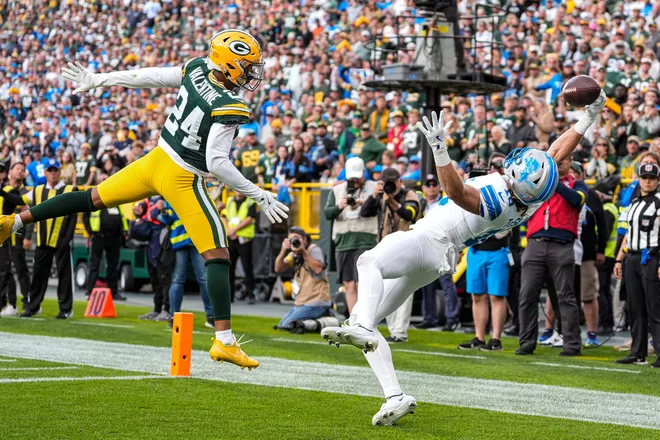 Detroit Lions wide receiver Isaac TeSlaa (18) makes a catch for a touchdown against Green Bay Packers cornerback Carrington Valentine (24) during the second half at Lambeau Field in Green Bay, Wis., on Sunday, September 7, 2025.