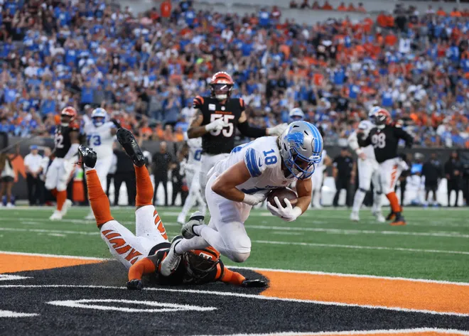 Oct 5, 2025; Cincinnati, Ohio, USA; Detroit Lions wide receiver Isaac Teslaa (18) scores a touchdown during the fourth quarter against the Cincinnati Bengals at Paycor Stadium. Mandatory Credit: Joseph Maiorana-Imagn Images