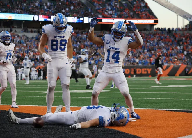 Oct 5, 2025; Cincinnati, Ohio, USA; Detroit Lions wide receiver Isaac Teslaa (18) celebrates a touchdown with tight end Brock Wright (89) and wide receiver Amon-Ra St. Brown (14) during the fourth quarter against the Cincinnati Bengals at Paycor Stadium. Mandatory Credit: Joseph Maiorana-Imagn Images