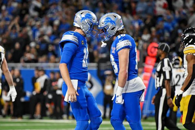 Dec 21, 2025; Detroit, Michigan, USA; Detroit Lions wide receiver Isaac Teslaa (18) scores a touchdown during the third quarter against the Pittsburgh Steelers at Ford Field. Mandatory Credit: Lon Horwedel-Imagn Images