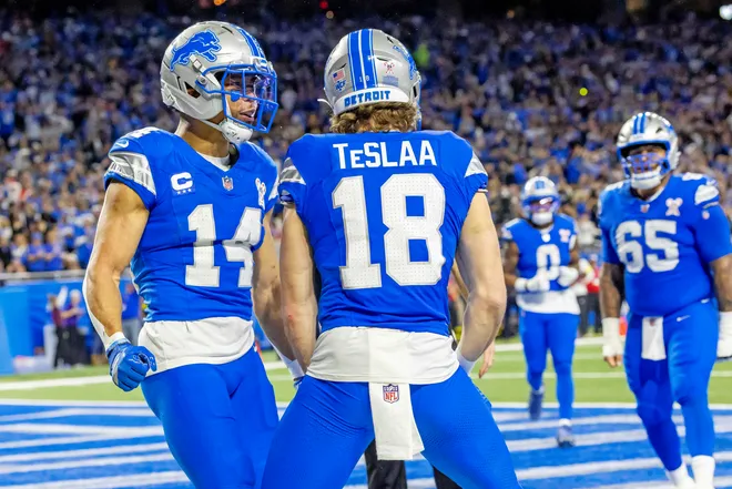 Dec 21, 2025; Detroit, Michigan, USA; Detroit Lions wide receiver Isaac Teslaa (18) scores a touchdown during the third quarter against the Pittsburgh Steelers at Ford Field. Mandatory Credit: David Reginek-Imagn Images