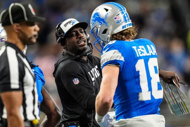 Detroit Lions assistant head coach and wide receivers coach Scottie Montgomery celebrates a touchdown against Pittsburgh Steelers scored by wide receiver Isaac Teslaa (18) during the first half at Ford Field in Detroit on Sunday, Dec. 21, 2025.