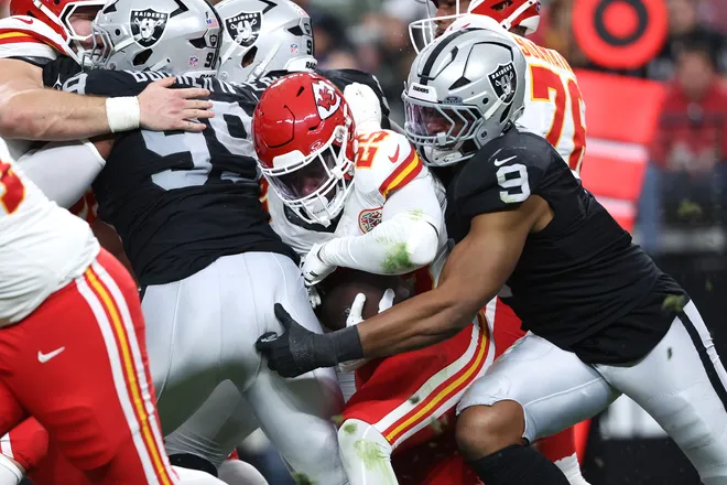 LAS VEGAS, NEVADA - JANUARY 04: Dameon Pierce #25 of the Kansas City Chiefs is tackled by Tyree Wilson #9 of the Las Vegas Raiders during the first quarter of the game at Allegiant Stadium on January 04, 2026 in Las Vegas, Nevada. (Photo by Ian Maule/Getty Images)