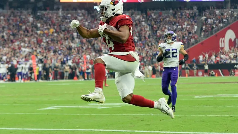 Sep 19, 2021; Glendale, Arizona, USA; Arizona Cardinals wide receiver Rondale Moore (4) scores a touchdown against the Minnesota Vikings during the first half at State Farm Stadium. Mandatory Credit: Joe Camporeale-USA TODAY Sports