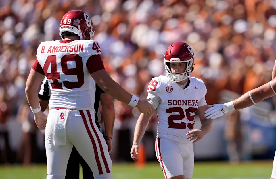 Oklahoma Sooners kicker Tate Sandell (29) celebrates with Oklahoma Sooners long snapper Ben Anderson (49) after a field goal in the first half of the Red River Rivalry college football game between the University of Oklahoma Sooners and the Texas Longhorn at the Cotton Bowl Stadium in Dallas, Texas, Saturday, Oct. 11, 2025.