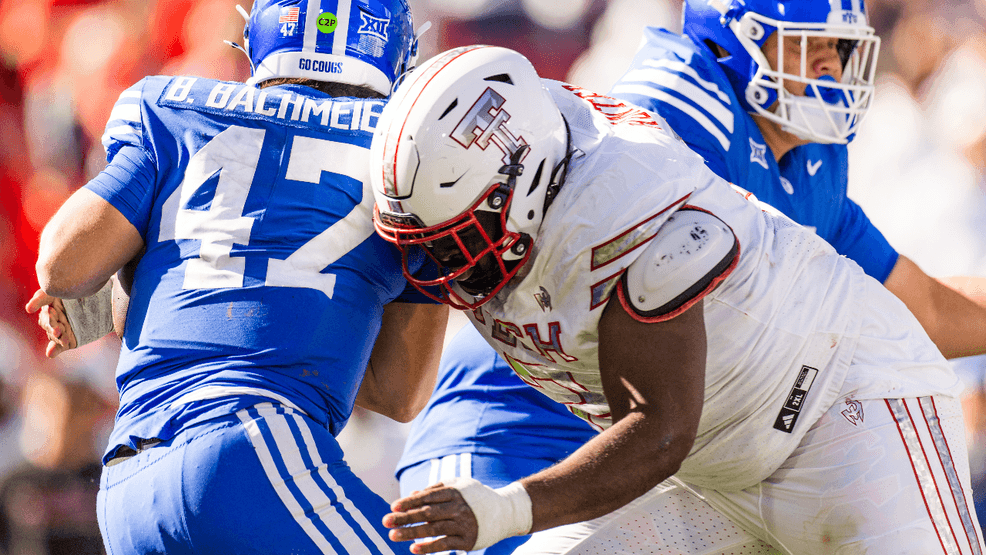 Lee Hunter #2 of the Texas Tech Red Raiders hits Bear Bachmeier #47 of the BYU Cougars during the second half of the game at Jones AT&T Stadium on November 08, 2025 in Lubbock, Texas.  (Photo by John E. Moore III/Getty Images)