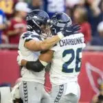 Seattle Seahawks running back Zach Charbonnet (26) celebrates a touchdown with teammate Jake Bobo against the Arizona Cardinals in the first half at State Farm Stadium on Dec 8, 2024.