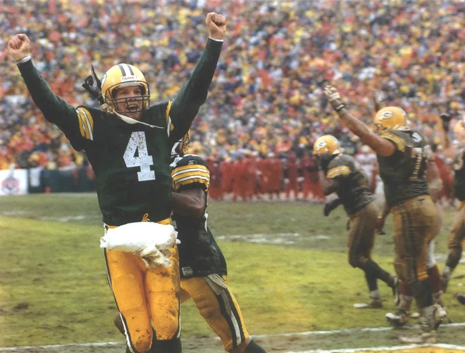Packers quarterback Brett Favre shows his delight after Edgar Bennett's goal-line fumble was recovered by Antonio Freeman for a touchdown in the third quarter of the January 4 Divisional playoff win against San Francisco. The Packers defeated the 49ers that day, 35-14. January 29, 1997. 1997 Press Photo Packers Quarterback Brett Favre Celebrates Teams Touchdown. © JIM GEHRZ/MILWAUKEE JOURNAL SENTINEL / USA TODAY NETWORK.