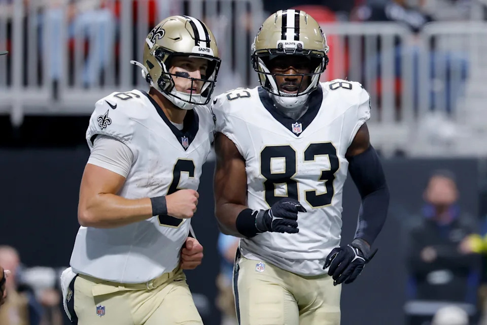 ATLANTA, GEORGIA - JANUARY 04: Tyler Shough #6 and Juwan Johnson #83 of the New Orleans Saints react after Shough's touchdown during the second quarter of the game against the Atlanta Falcons at Mercedes-Benz Stadium on January 04, 2026 in Atlanta, Georgia. (Photo by Todd Kirkland/Getty Images)