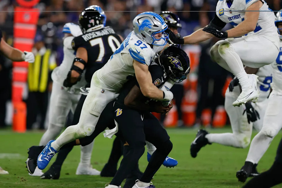 Detroit Lions defensive end Aidan Hutchinson (97) sacks Baltimore Ravens quarterback Lamar Jackson.Peter Casey-Imagn Images