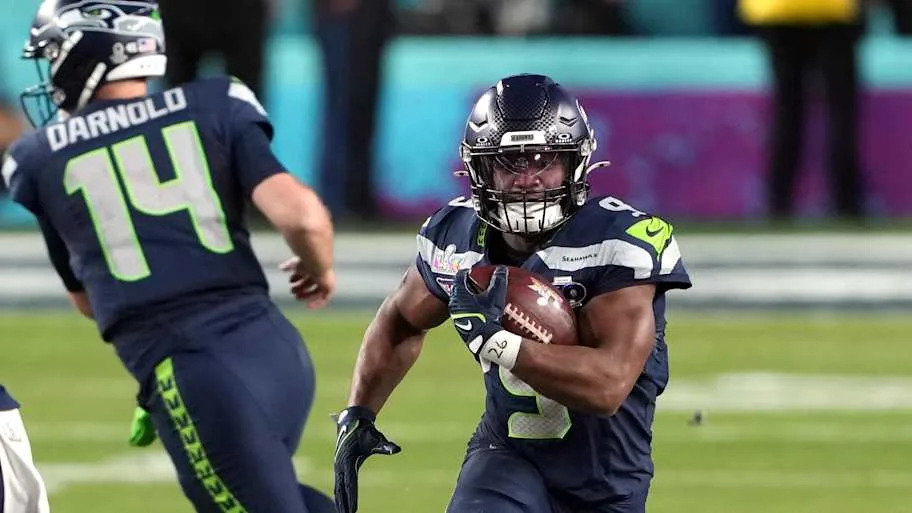 Seattle Seahawks running back Kenneth Walker III (9) carries the ball against the New England Patriots