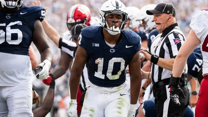 Penn State running back Nick Singleton celebrates after scoring a 2-yard rushing touchdown in the first half of an NCAA football game against Indiana Saturday, Oct. 28, 2023, in State College, Pa. The Nittany Lions won, 33-24. © Dan Rainville / USA TODAY NETWORK.
