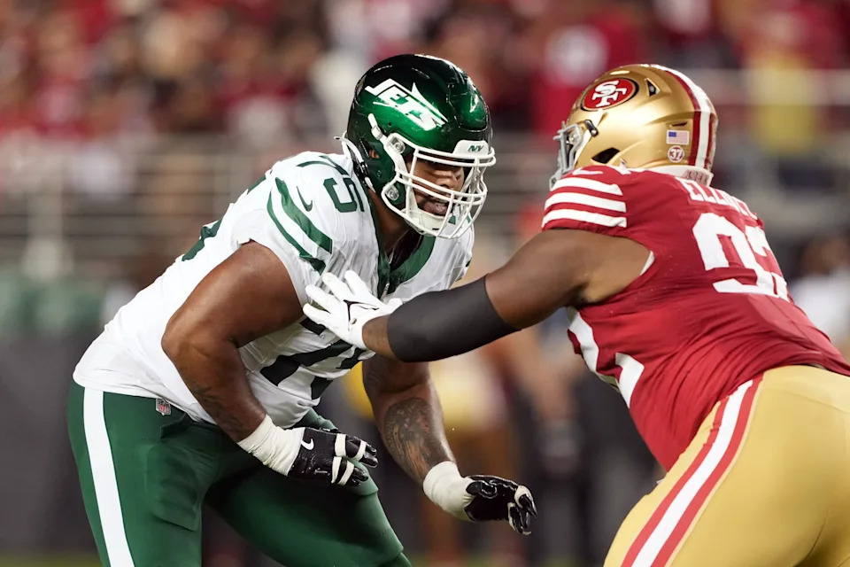 Sep 9, 2024; Santa Clara, California, USA; New York Jets guard Alijah Vera-Tucker (75) blocks against San Francisco 49ers defensive tackle Jordan Elliott (right) during the fourth quarter at Levi's Stadium. Mandatory Credit: Darren Yamashita-Imagn Images