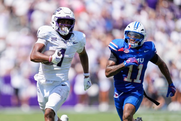 TCU wide receiver Eric McAlister (1) sprints to the end zone for a touchdown after catching a pass as SMU safety Jaden Milliner-Jones (11) gives chase in the second half of a game Saturday, Sept. 20, 2025, in Fort Worth, Texas. (AP Photo/Tony Gutierrez)
