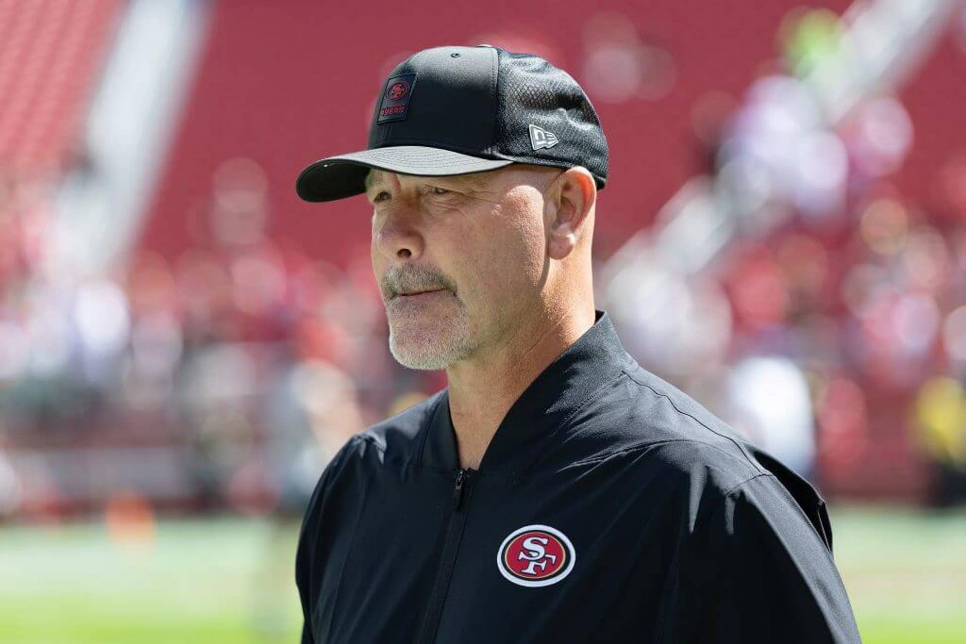 San Francisco 49ers assistant head coach defense Gus Bradley walks toward the bench area before an NFL football game against the Arizona Cardinals, Sunday, Sept. 21, 2025, in Santa Clara, Calif.